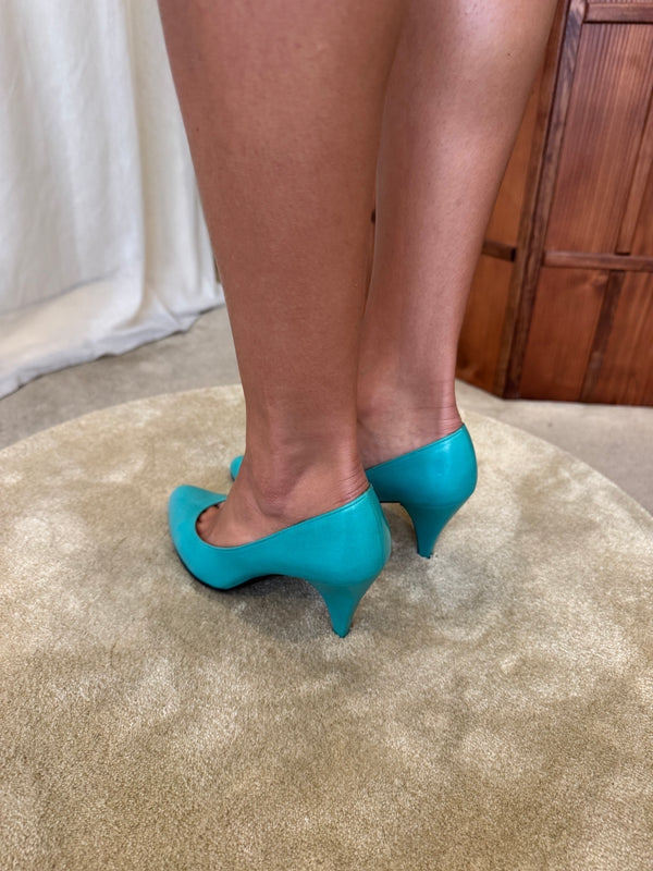 Turquoise Charles Jourdan pumps.