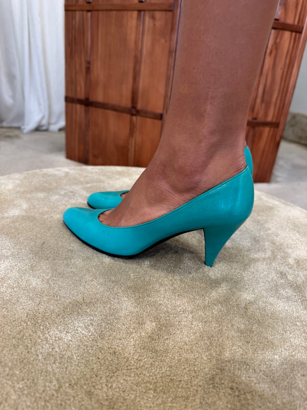 Turquoise Charles Jourdan pumps.